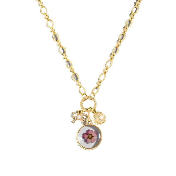 A unique gold plated chain necklace featuring acrylic flower coin pendants and bow charms, adjustable length. This is a statement piece. Wear alone or layered, this would also make a great gift. 