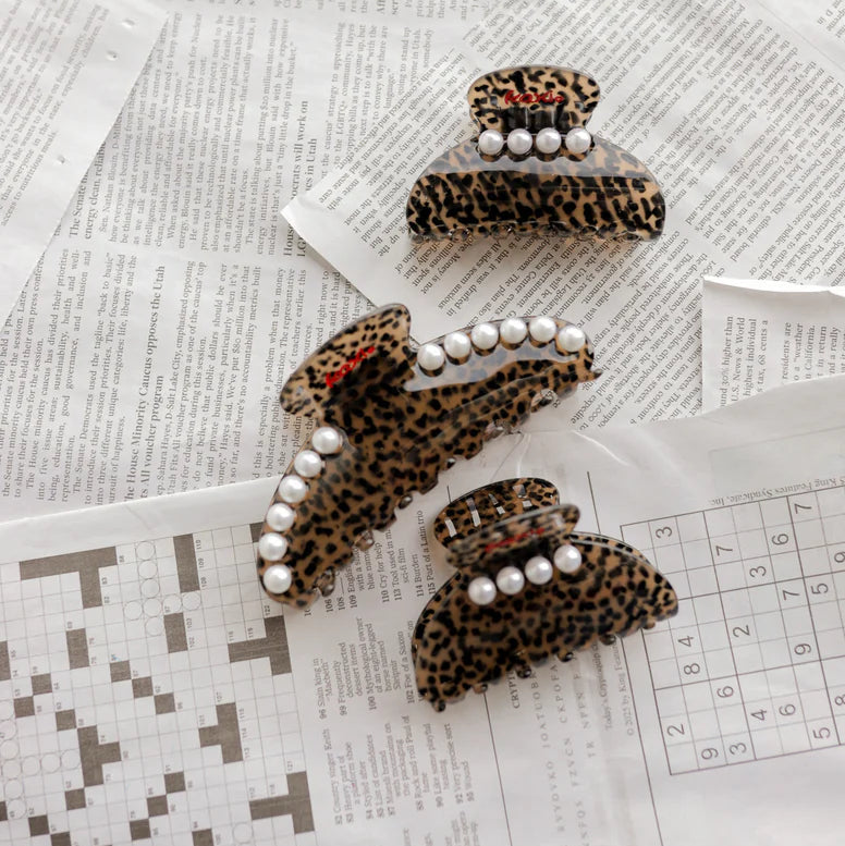 This KAXI Love Is In The Hair Claw is Chic and durable, cheetah print hair claw, perfect for effortlessly securing and styling all hair types. Has beautiful, trendy, pearl details too.