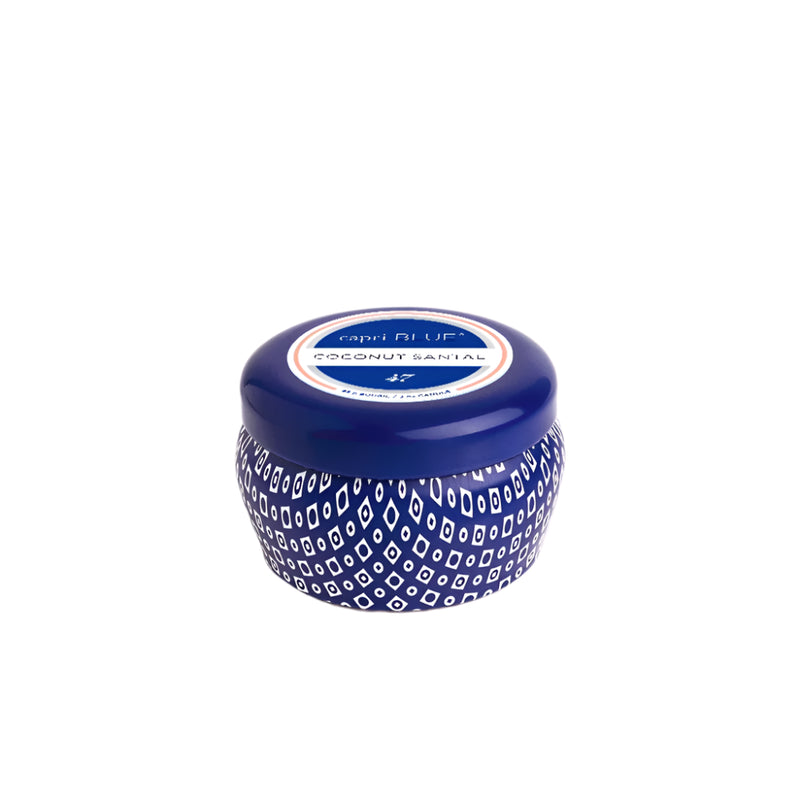 From Capri Blue the 3oz Coconut Santal Mini Tin Candle - Fresh Coconut & Warm Santal Scent. Great for gifts and is tiny and compact to bring the warm tropical scent to any space. 